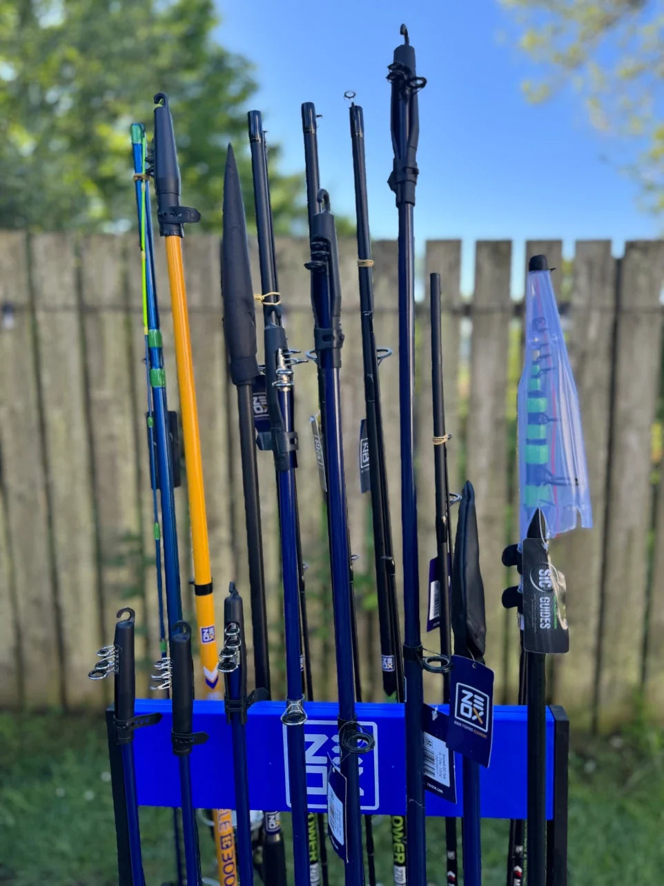 Sixteen ready rod and reel combos with storage rack included, wholesale fishing set